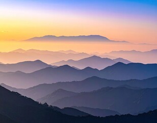 Dawn breaks over layered mountain ranges, painting the sky with colors