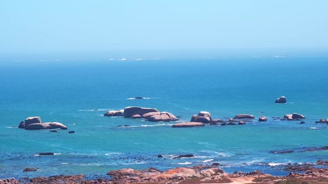 Rounded rock boulders near Cape West coast Atlantic shoreline in Paternoster