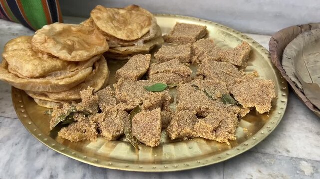 Puri and halwa prepared for a Hindu wedding in India