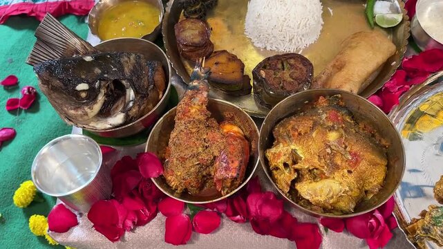 In Bengal&rsquo;s rice ceremony, a thali of rice and treasured fishes&mdash;Bhetki, Pabda, Chingri, and Katla&mdash;graces the table.