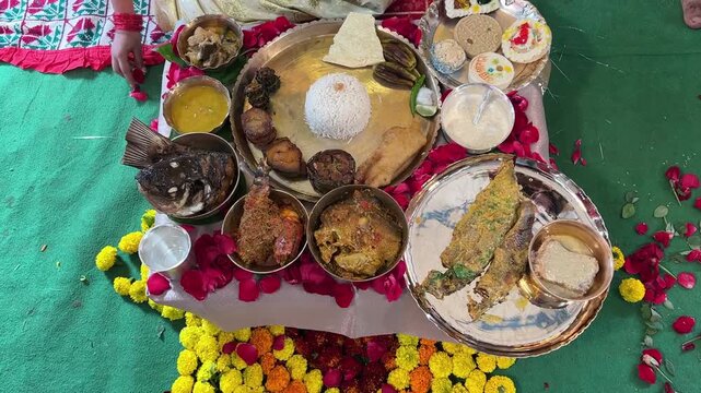 Traditional rice ceremony thali of Bengal, served with rice and multiple fish delicacies, including Bhetki, Pabda, Chingri, and Katla.
