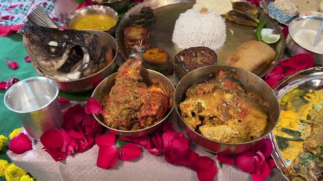 A festive Bengali rice ceremony platter with rice and a selection of classic fishes&mdash;Bhetki, Pabda, Chingri, and Katla.