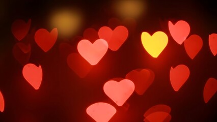 Heart-Shaped Lights in Red, Pink, and Yellow Against Dreamy Dark Background