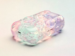 Iridescent Translucent Tech Case with Water Droplets on Pastel Background