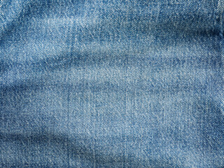 Naklejka premium Blue jeans denim fabric texture background with diagonal weawing. Closeup, macro jeans background. Design element.