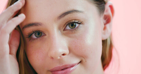 Happy, portrait and woman with makeup, studio and pride with mascara for change, beauty or cosmetics. Confident, person and self care with makeover, pink background and foundation for face in USA