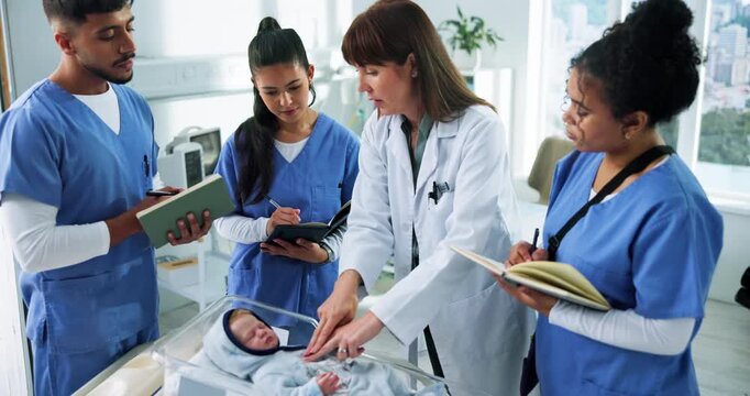 People, baby doll and students with tutorial, discussion or writing with paedetrician. University, medical interns or learning with lesson, neonatal or dummy with healthcare education or notebook