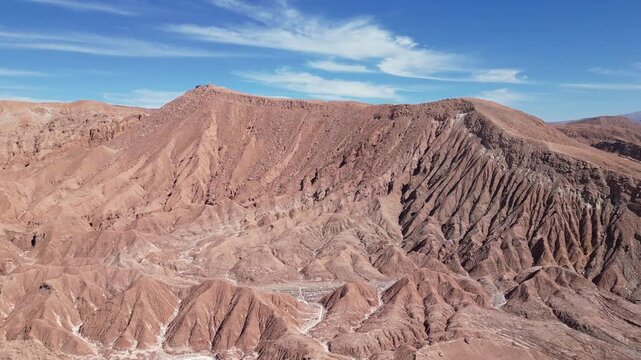 San Pedro de Atacama, Chile: Cinematic forward aerial drone footage of rock formation of Mars valley in San Pedro de Atacama, Chile on sunny day in south America