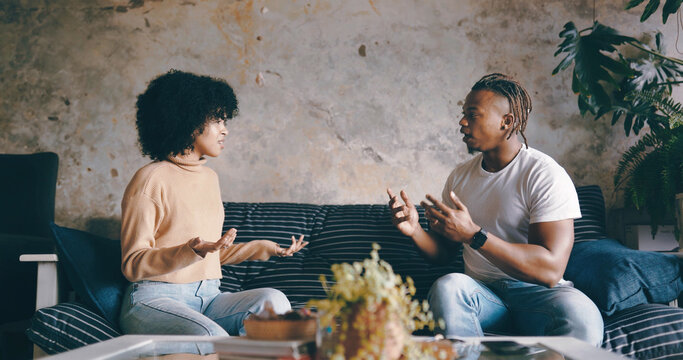 Home, conflict and couple on sofa, argument and fighting with toxic relationship. Apartment, black man and woman on couch, angry and disagreement with cheating, divorce and unhappy with breakup