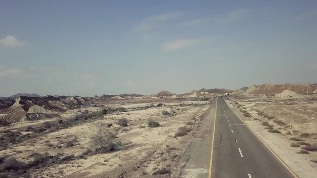 180-Degree Aerial Drone View of Bus Passing on Makran Coastal Highway, Balochistan, Pakistan