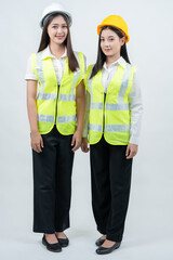 A vertical photograph of two Asian female engineers standing as company presenters highlights AI-driven planning, intelligent industrial innovation, professional teamwork, and modern workplace safety.
