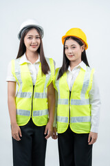 The vertical photograph shows two Asian female engineers standing together, highlighting AI-powered construction planning, intelligent workflows, professional teamwork, and industry safety awareness.