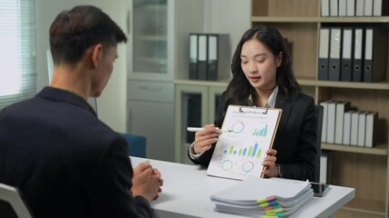 Businesswoman presenting financial data report to colleague - Powered by Adobe