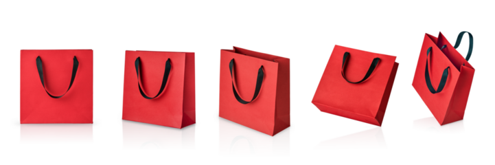 Set of red paper gift bags with black handles isolated on white background with clipping path. Design element. Holiday Sale Concept.