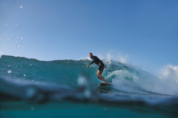 Surfer Riding OpenFaced Wave From Low Water Perspective