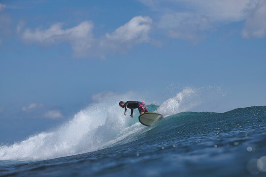 Surfer Trimming Along Clean Green Wave
