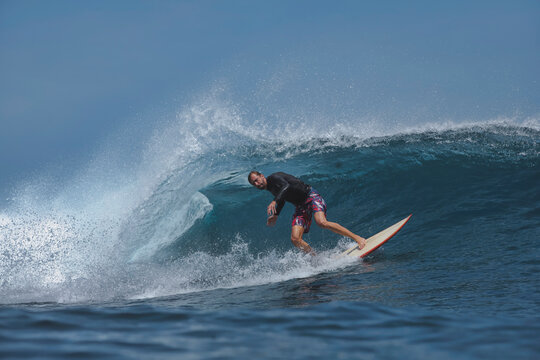 Surfer Executing Smooth Cutback On Glassy Wave