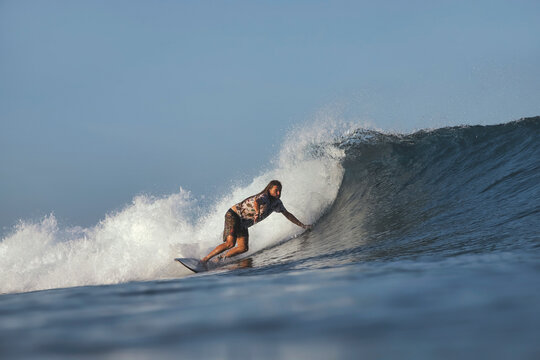 Surfer Powering Aggressive Carve Near Wave Lip