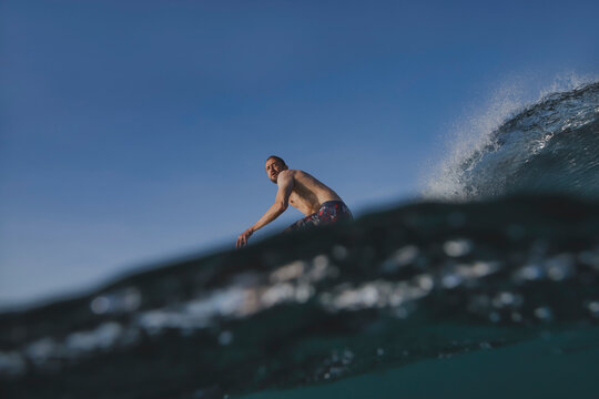 urfer Carving On Open Wave Face, LowSlung Stance Cutting Through Spray