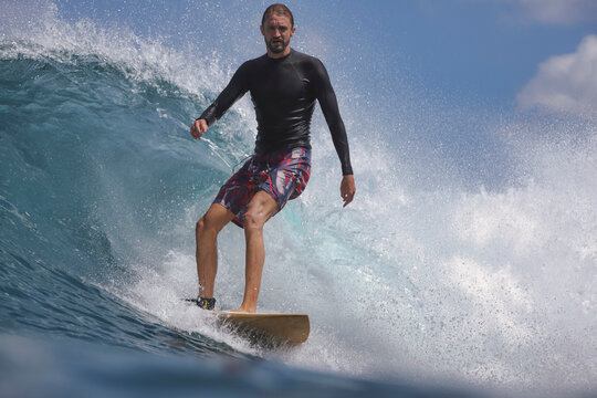 Surfing Intense Wave, Single Rider Maneuvers Through Cresting Wave