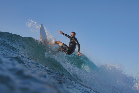 Surfer Releasing Tail On Steep Section