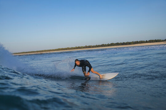 Surfer Carving Sharp Turn On Breaking Wave