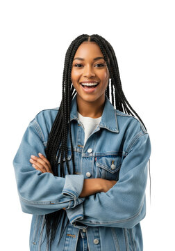 Young african american woman, early 20s, in light blue denim jacket, crossing arms with a radiant smile in high-key studio light. Concept of confident modern positivity