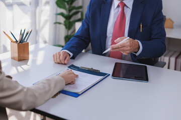 Professional businessman discussing resume with job candidate
