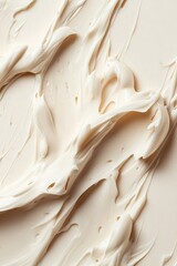 Creamy, beige textured surface with swirling pattern
