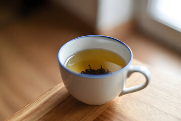 cup of tea on the woden table