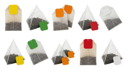 variety of tea bags with colorful tags arranged on a black background isolated transparent