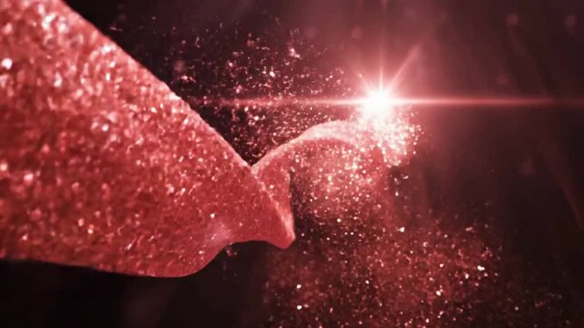 Red sparkling particles emanating from a textured form with a bright light source in a dark, abstract setting.