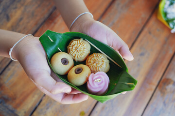 Thai dessert served on banana leaf. Thai traditional desserts for sale in the landmark travel (Mallika city), Kanchanaburi Thailand.