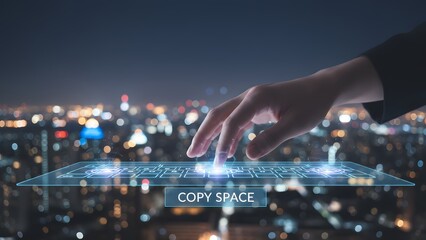 Hand Interacting with Virtual Cityscape Interface at Night.