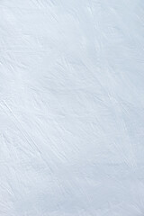 Obraz premium An snowy snow - ice surface as an mountain ski descent. Winter sports texture.