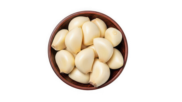 Peeled garlic cloves in a small wooden bowl isolated on transparent background