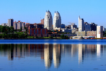 Obraz premium Beautiful tall white towers, skyscrapers, buildings, in summer and spring. Best view of Dnipro city street