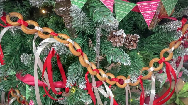 Close-up of a festive Christmas tree with red decorations. New Year's decorations concept.