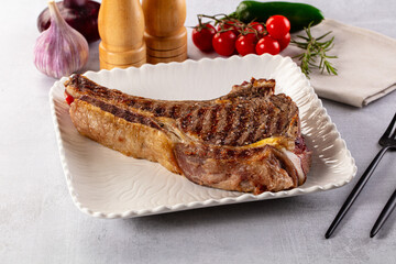 Grilled ribeye beef steak with bone