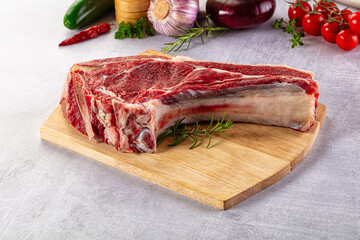 Raw prime beef steak with bone