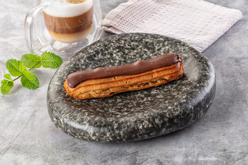 Gourmet chocolate eclair with icing