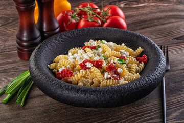 Italian pasta fusili with curd