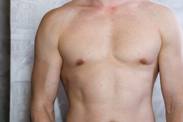 Fototapeta premium Muscular male torso close-up in mirror selfie