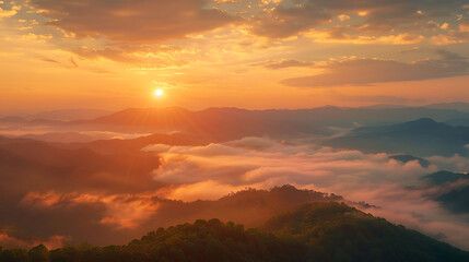 Radiant golden sunrise illuminating foggy mountain ridges, creating a serene and atmospheric landscape filled with warmth and morning calm.
