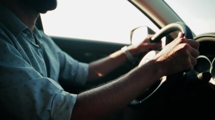Driver steering modern vehicle during golden hour . Road trip journey