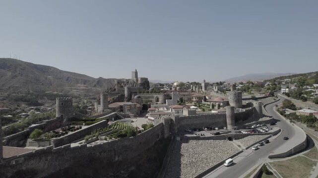 Aerial view of Rabati Castle, a medieval fortified complex in Akhaltsikhe, Georgia, featuring historic stone walls and towers set within the mountainous Samtskhe Javakheti region