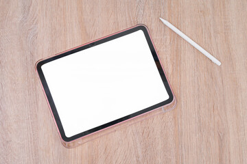 Modern Tablet With Blank Screen and Stylus on Wooden Desk