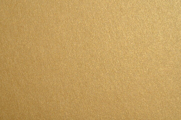 Golden sparkling texture shining brightly, creating a shimmering and abstract luxurious concept background