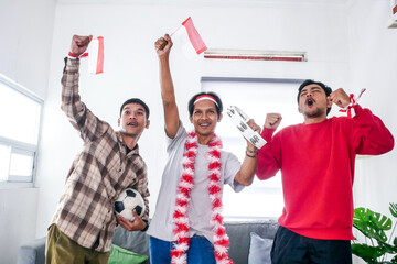Friends Cheering for Their Favorite Soccer Team With Flags and Tickets