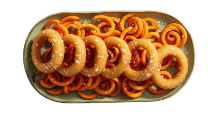 Isolated plate of curly sweet potato fries with fried onion rings, sea salt sprinkled on top
